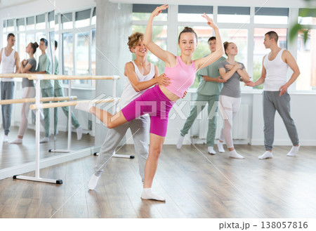 Ballet training for teenagers in a ballet studio under the guidance of choreographer Ballet training for teenagers in a ballet studio under the guidance of choreographer 138057816
