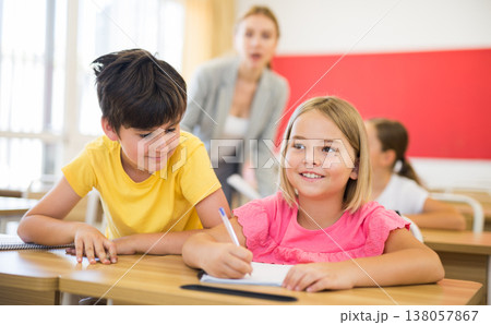 Kid cheating during test Kid cheating during test 138057867