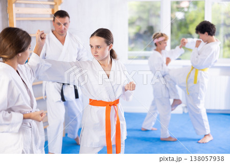 Two girls training karate techniques in studio 138057938
