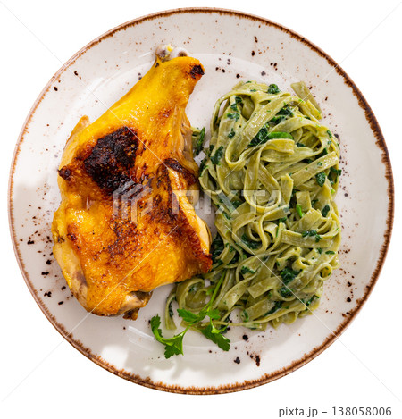 Delicious chicken thigh and spinach pasta close up Delicious chicken thigh and spinach pasta close up 138058006