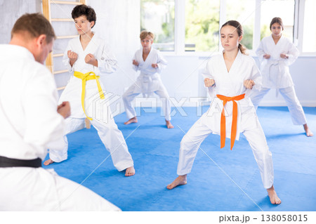 Preteen children during karate training. Martial arts. Sport, active lifestyle concept Preteen children during karate training. Martial arts. Sport, active lifestyle concept 138058015