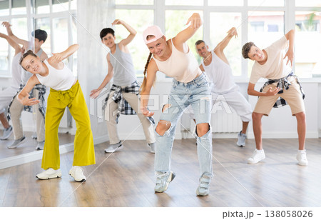 Teenage girl dancing hip hop in group 138058026