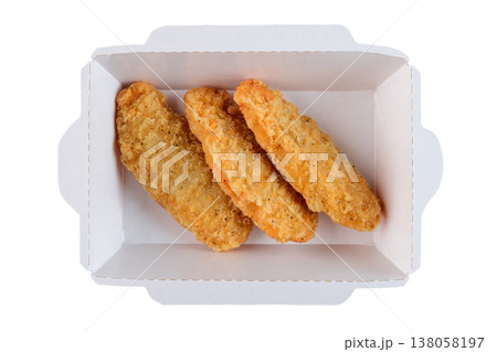 Freshly baked crispy chicken strip in white paper take out container on white background top view close up flat lay with copy space delicious snack Freshly baked crispy chicken strip in white paper take out container on white background top view close up flat lay with copy space delicious snack 138058197