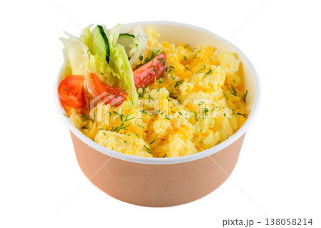 Fluffy scrambled egg with fresh tomato cucumber and lettuce salad in craft paper take out bowl on white background side view close up with copy space Fluffy scrambled egg with fresh tomato cucumber and lettuce salad in craft paper take out bowl on white background side view close up with copy space 138058214