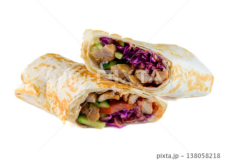 Fresh chicken shawarma wrap cut in half with red cabbage and cucumber on white background side view with copy space delicious savory meat snack Fresh chicken shawarma wrap cut in half with red cabbage and cucumber on white background side view with copy space delicious savory meat snack 138058218