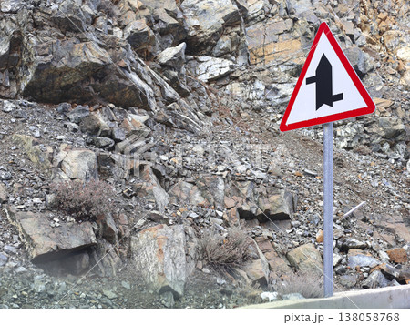 Warning Sign Beside Rocky Mountain Road Warning Sign Beside Rocky Mountain Road 138058768