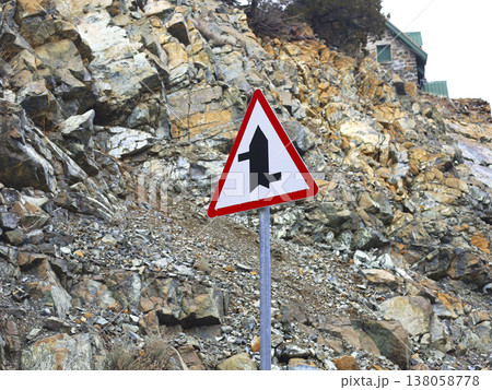 Triangular Merge Warning Sign On Rocky Road 138058778