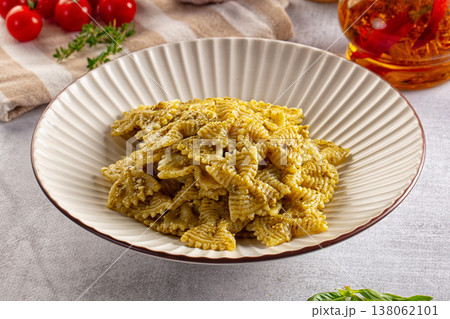 Italian green pasta farfalle with pesto 138062101
