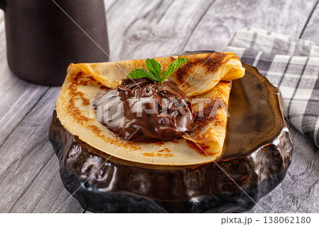 Sweet pancake with chocolate paste Sweet pancake with chocolate paste 138062180