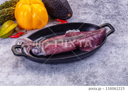 Fresh raw squid on a plate with exotic vegetables for cooking Fresh raw squid on a plate with exotic vegetables for cooking 138062225