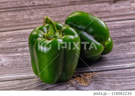 Fresh green bell peppers on a rustic table Fresh green bell peppers on a rustic table 138062230