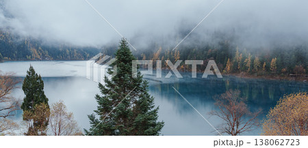 Scenery Jiuzhaigou national park in Sichuan, China. Beautiful Long lake and snow mountain in Autumn season. Famous Landmark and Vacation near Chengdu, China. Asia travel concept Scenery Jiuzhaigou national park in Sichuan, China. Beautiful Long lake and snow mountain in Autumn season. Famous Landmark and Vacation near Chengdu, China. Asia travel concept 138062723