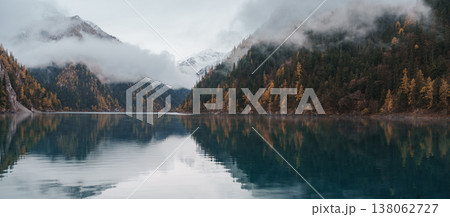 Scenery Jiuzhaigou national park in Sichuan, China. Beautiful Long lake and snow mountain in Autumn season. Famous Landmark and Vacation near Chengdu, China. Asia travel concept Scenery Jiuzhaigou national park in Sichuan, China. Beautiful Long lake and snow mountain in Autumn season. Famous Landmark and Vacation near Chengdu, China. Asia travel concept 138062727
