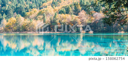 Scenery Jiuzhaigou national park in Sichuan, China. Beautiful Five Flower Lake in Autumn season. Famous Landmark and Vacation near Chengdu, China. Asia travel concept Scenery Jiuzhaigou national park in Sichuan, China. Beautiful Five Flower Lake in Autumn season. Famous Landmark and Vacation near Chengdu, China. Asia travel concept 138062754