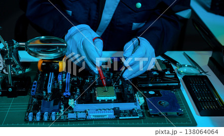 Macro photo of a finger touching a laptop chip close up Macro photo of a finger touching a laptop chip close up 138064064