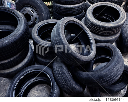 Outdoor storage area with aged tires emphasizing recycling and reuse opportunities Outdoor storage area with aged tires emphasizing recycling and reuse opportunities 138066144