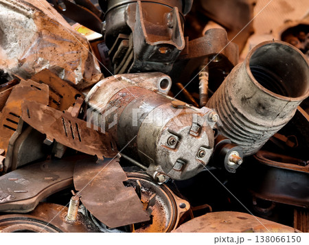 Pile of rusted motor components and gears in cluttered scrap heap Pile of rusted motor components and gears in cluttered scrap heap 138066150