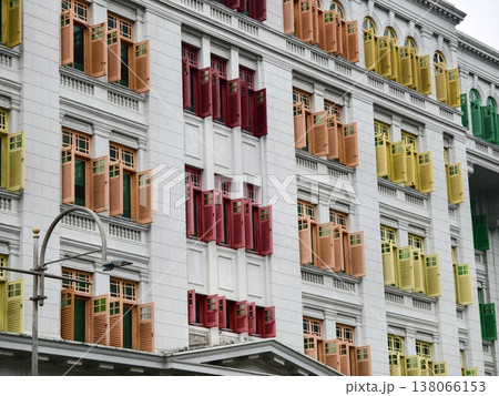 Historic building facade showcasing colorful shutters and intricate architectural elements Historic building facade showcasing colorful shutters and intricate architectural elements 138066153