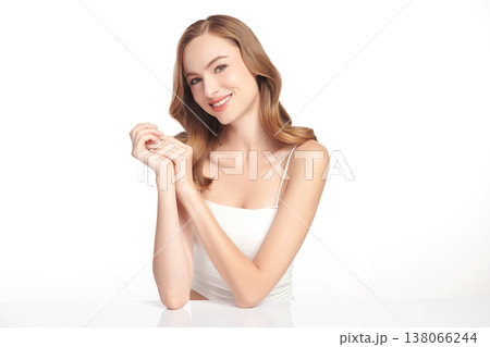 A beautiful young woman with clean, fresh skin against a white background. Skincare, facial treatment, cosmetology, beauty, and spa. An elegant portrait of an woman. A beautiful young woman with clean, fresh skin against a white background. Skincare, facial treatment, cosmetology, beauty, and spa. An elegant portrait of an woman. 138066244