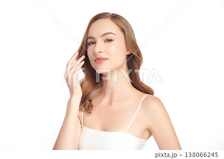 A beautiful young woman with clean, fresh skin against a white background. Skincare, facial treatment, cosmetology, beauty, and spa. An elegant portrait of an woman. A beautiful young woman with clean, fresh skin against a white background. Skincare, facial treatment, cosmetology, beauty, and spa. An elegant portrait of an woman. 138066245