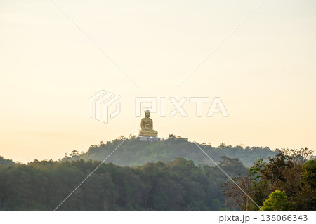 Golden Buddha statue on hilltop in Kanchanaburi, Thailand Golden Buddha statue on hilltop in Kanchanaburi, Thailand 138066343