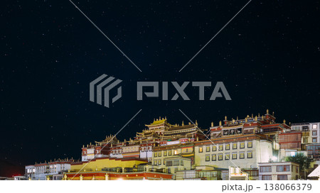 Starry night sky above Songzanlin Monastery in Shangri La. China 138066379