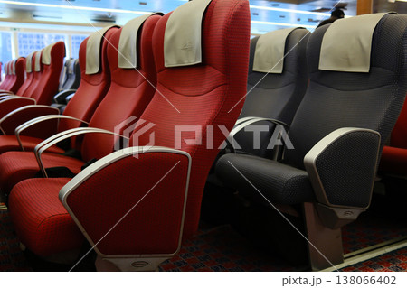 Rows of red and gray reclining passenger seats inside high speed ferry cabin on Hong Kong Macau route Rows of red and gray reclining passenger seats inside high speed ferry cabin on Hong Kong Macau route 138066402