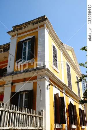Yellow and white Portuguese colonial building corner 138066410