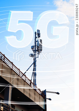 5G network tower with signal waves above a building during daylight hours 5G network tower with signal waves above a building during daylight hours 138069247
