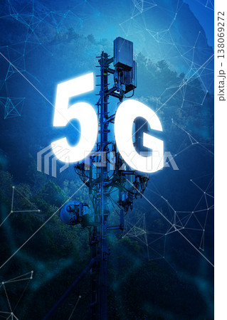 5G internet tower standing tall in a rural area with blue accents around it 138069272