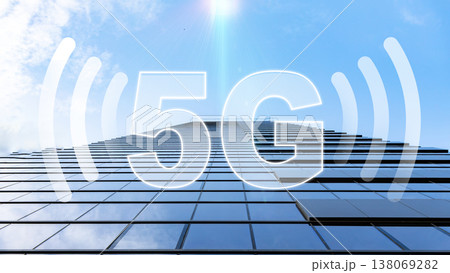 5G internet signal shown on a tall building under a blue sky with clouds 5G internet signal shown on a tall building under a blue sky with clouds 138069282