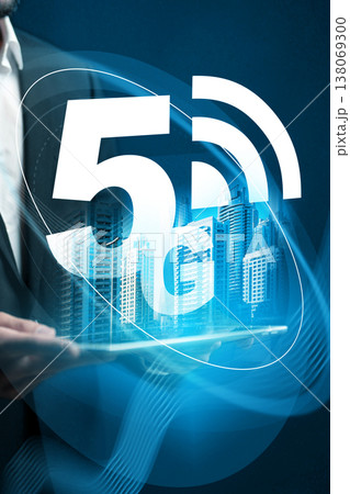 5G internet technology displayed with a city skyline and person using a tablet 138069300