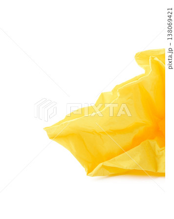Wrinkled yellow paper placed on a white surface with soft light shining from above Wrinkled yellow paper placed on a white surface with soft light shining from above 138069421