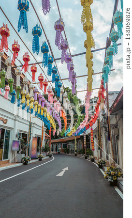 Colorful paper lanterns hanging over asian street alley, vibrant multicolor festival lanterns above narrow old town alleyway, Bangkok Thailand Colorful paper lanterns hanging over asian street alley, vibrant multicolor festival lanterns above narrow old town alleyway, Bangkok Thailand 138069826