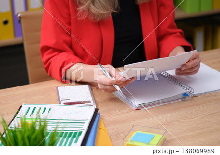 Working diligently on business reports and plans in a bright and organized office setting during the afternoon 138069989
