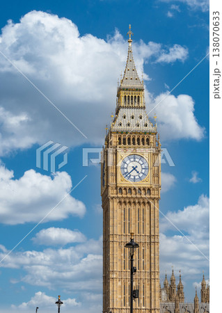 Big Ben clock tower against a blue sky with fluffy white clouds Big Ben clock tower against a blue sky with fluffy white clouds 138070633