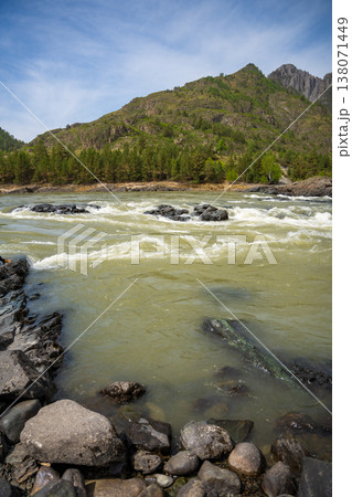 Yelandinsky rapid on the Katun river in Altai Russia. Powerful mountain stream crashing over rocks in famous rafting destination. Yelandinsky rapid on the Katun river in Altai Russia. Powerful mountain stream crashing over rocks in famous rafting destination. 138071449