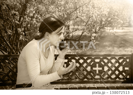 Young girl speaking by phone Young girl speaking by phone 138072513