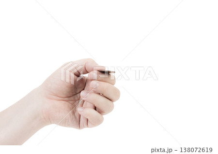 A man's hand is juggling a coin. 138072619