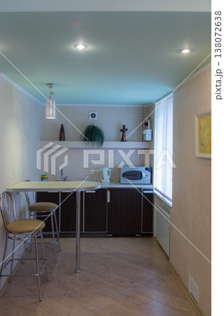 A small modern kitchen with a breakfast bar. A small modern kitchen with a breakfast bar. 138072638