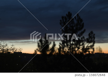 Beautiful sunrise from the window of a multi-storey building. Beautiful sunrise from the window of a multi-storey building. 138072648
