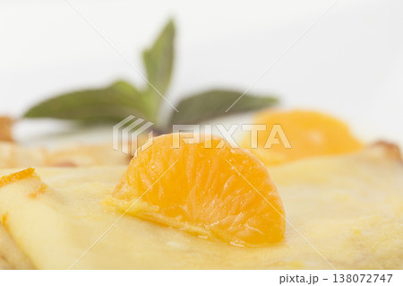 Slice of orange on crepes suzette. Slice of orange on crepes suzette. 138072747