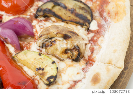 Vegetable pizza on a wooden tray. Vegetable pizza on a wooden tray. 138072758