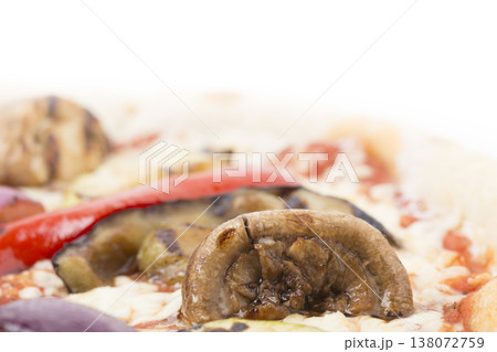 The mushroom on the vegetable pizza. 138072759