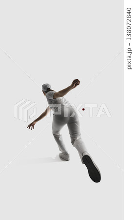 Female cricket player back view during bowling motion isolated on white. Female cricket player back view during bowling motion isolated on white. 138072840