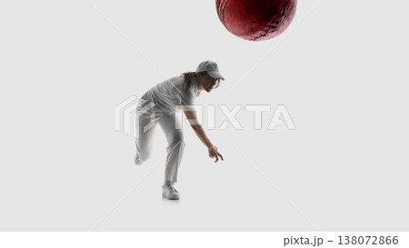 Female cricket player bowling ball action shot isolated on white background. 138072866