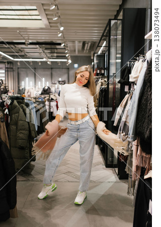 Happy Customer Holding Long Soft Scarf in Store 138073494