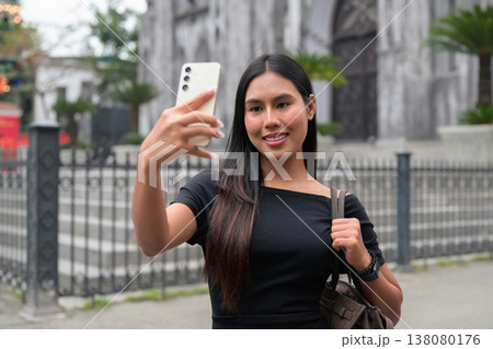 Thai Woman Using Smartphone at St Joseph's Cathedral Hanoi Vietnam Thai Woman Using Smartphone at St Joseph's Cathedral Hanoi Vietnam 138080176