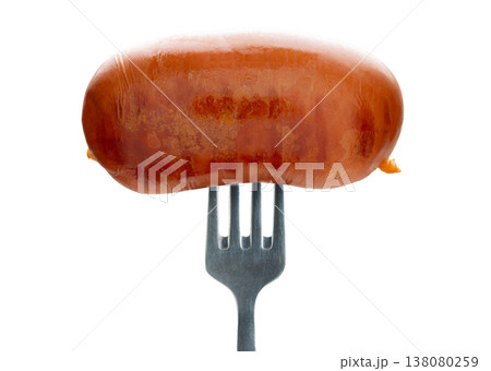 Appetizing sausage on a fork, isolated on white background Appetizing sausage on a fork, isolated on white background 138080259