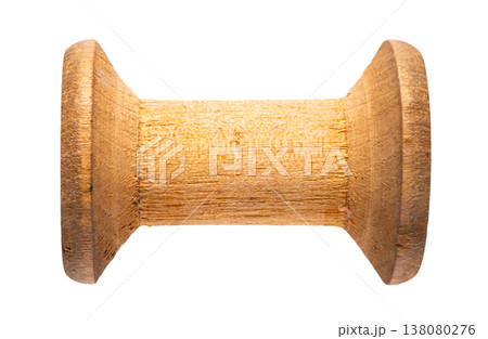 empty wooden sewing spool on white isolated background empty wooden sewing spool on white isolated background 138080276